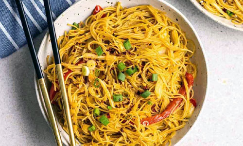 Vegetable Chow Fun noodles in a pan