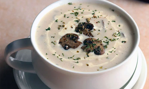 Warm Mushroom Soup in a round bowl